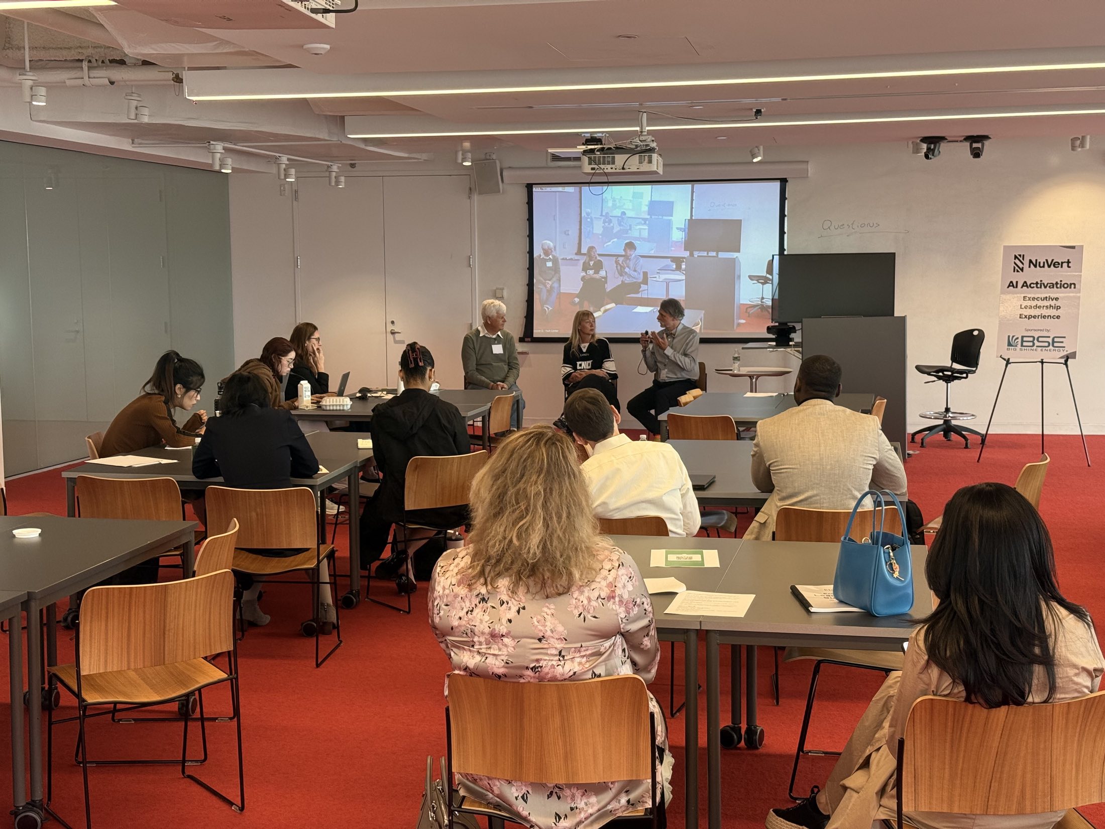 A panel discussion at a NuVert AI Activation session